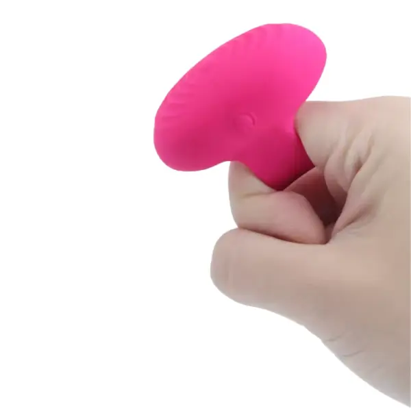 The Vibrosa Ring Finger Vibrator being held between fingers, demonstrating its compact size and comfortable grip for effortless control during use.