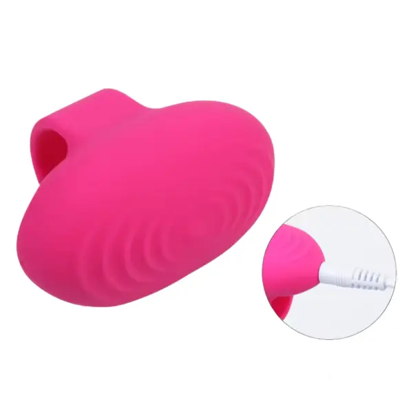 The Vibrosa Finger Vibrator shown alongside a charging cable, with an inset image highlighting the USB charging port for easy power-up.