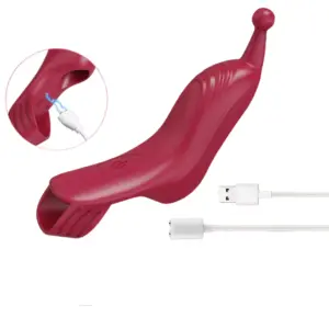 The Vintura Finger Vibrator shown with its magnetic USB charging cable, including an inset detail of the charging port for easy power connection.