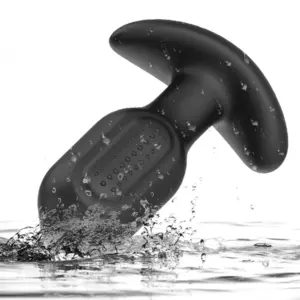 PulseDock textured anal vibrator shown in water to illustrate its waterproof silicone design and raised bump stimulation surface.